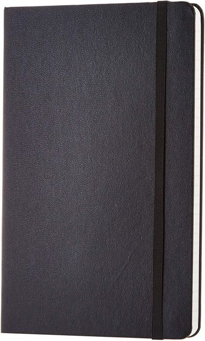 AmazonBasics Ruled hardcover notebook: Closed black ruled notebook.